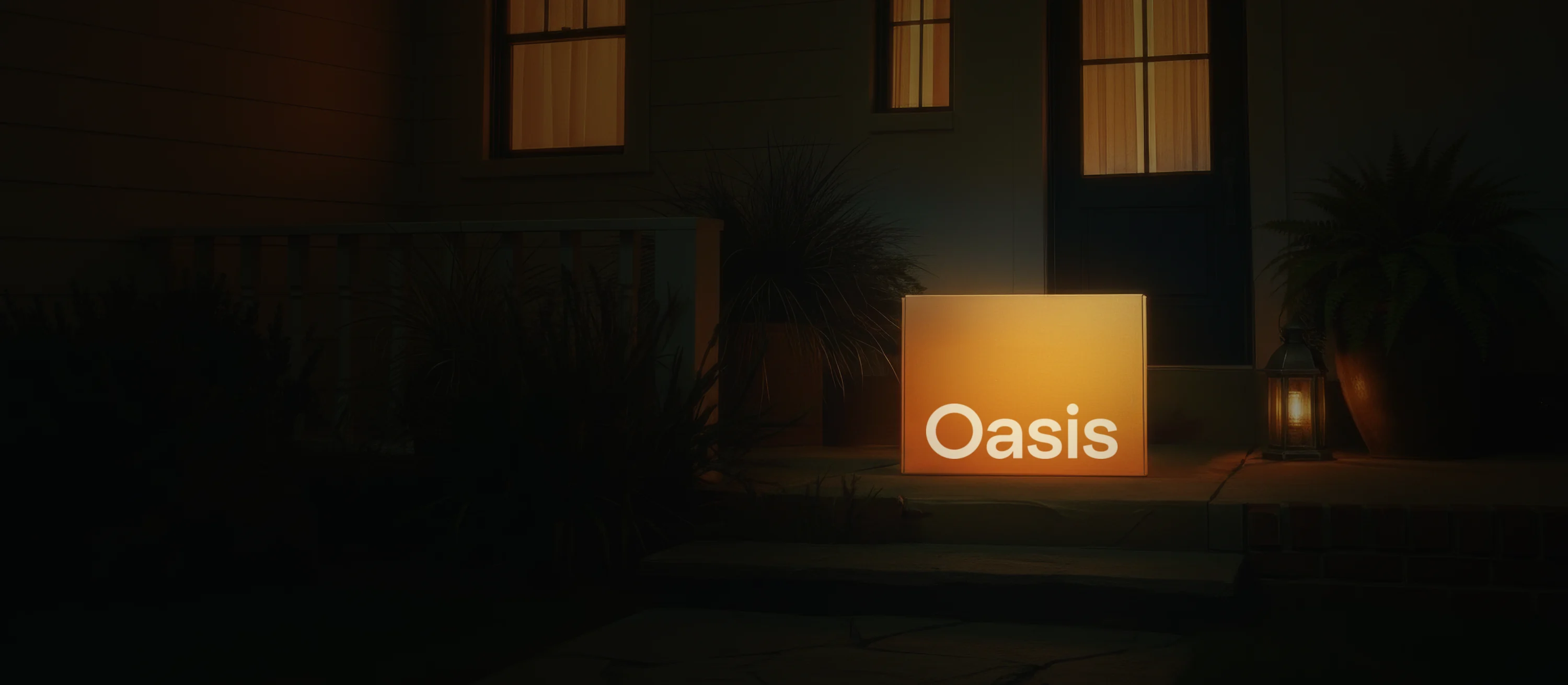 An Oasis box glowing warm on a front doorstep at night