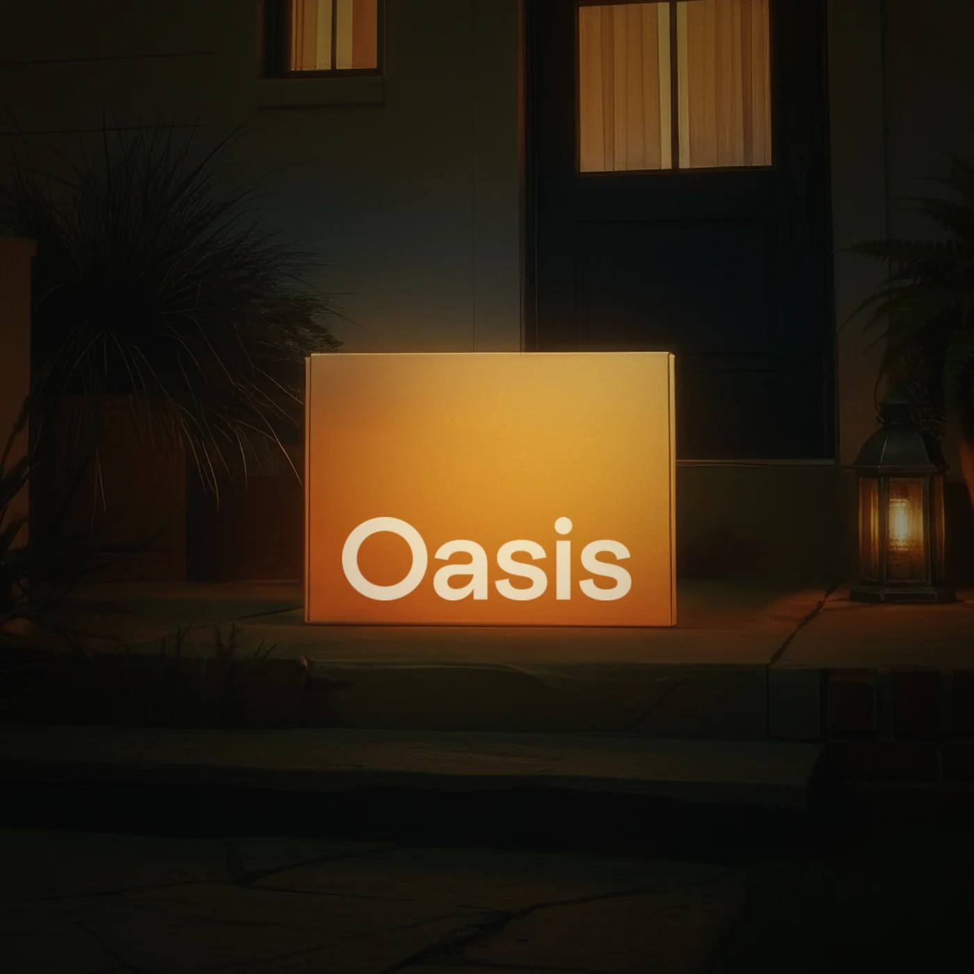 An Oasis box glowing warm on a front doorstep at night
