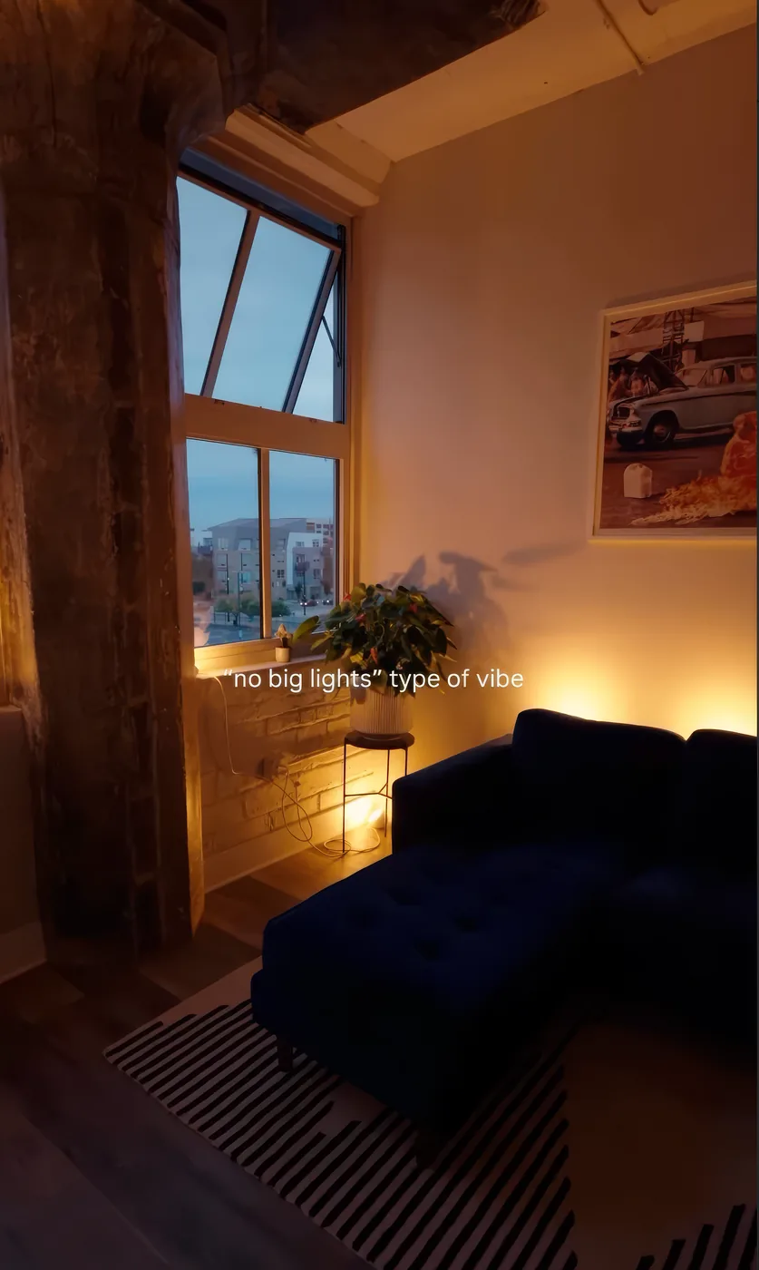 A loft at dusk with no big lights, just a warm glow, from @oasis_lighting